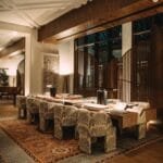 Cozy luxury hotel lobby interior with elegant furnishings and warm lighting at night.